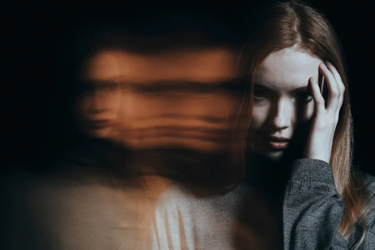 A conceptual image of a woman struggling with symptoms of bipolar disorder.