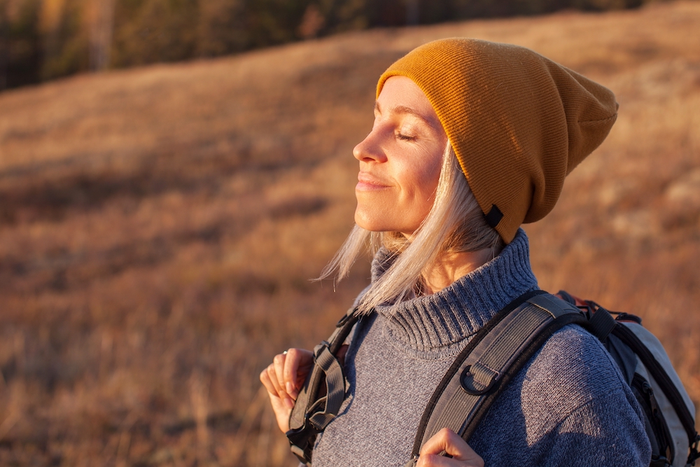 A woman connects with nature in recovery.