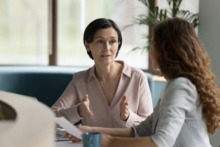 Two friends practice effective communication skills in addiction recovery.