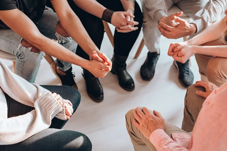 People participate in group therapy.