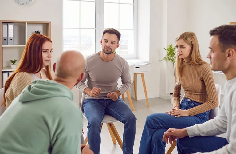 People participate in a psychoeducational group.