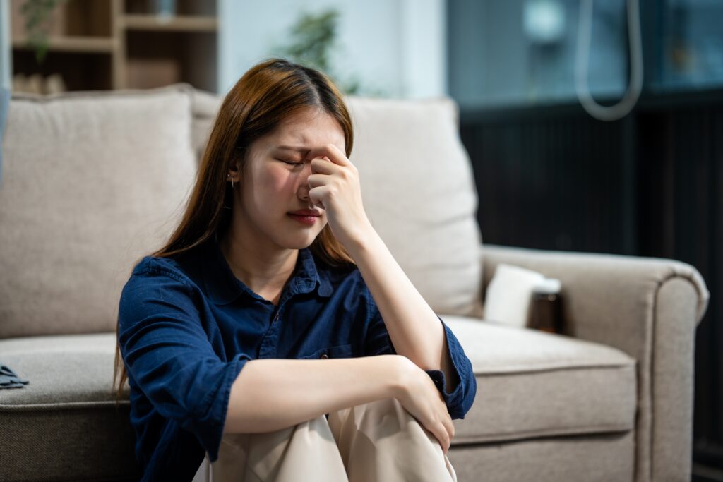 Young woman upset after learning and Understanding the Dangers of Kratom.